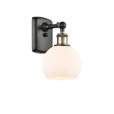 A large image of the Innovations Lighting 516-1W-10-6 Athens Sconce Black Antique Brass / Matte White