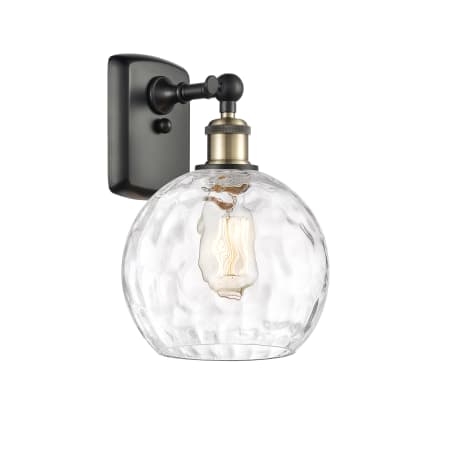 A large image of the Innovations Lighting 516-1W-13-8 Athens Sconce Black Antique Brass / Clear Water Glass