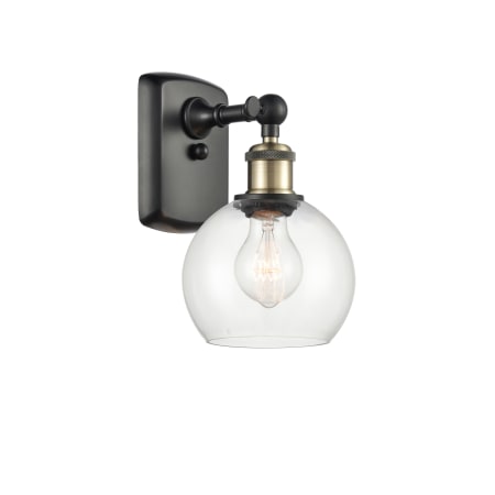 A large image of the Innovations Lighting 516-1W-9-6 Athens Sconce Black Antique Brass / Clear