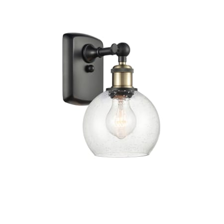 A large image of the Innovations Lighting 516-1W-10-6 Athens Sconce Black Antique Brass / Seedy