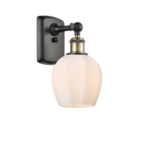 A large image of the Innovations Lighting 516-1W-10-6 Norfolk Sconce Black Antique Brass / Matte White