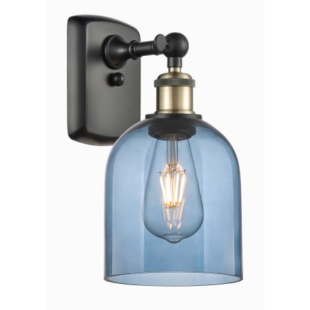 A large image of the Innovations Lighting 516-1W-11-6 Bella Sconce Black Antique Brass / Princess Blue