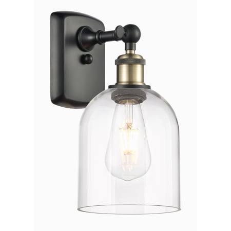 A large image of the Innovations Lighting 516-1W-11-6 Bella Sconce Black Antique Brass / Clear