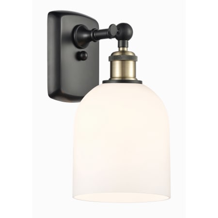 A large image of the Innovations Lighting 516-1W-11-6 Bella Sconce Black Antique Brass / Glossy White