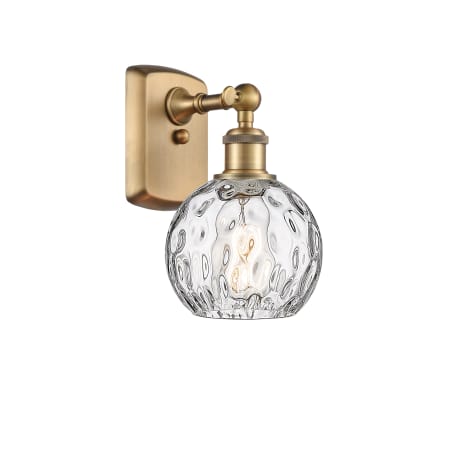 A large image of the Innovations Lighting 516-1W-11-6 Athens Sconce Brushed Brass / Clear Water Glass