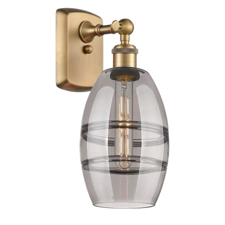 A large image of the Innovations Lighting 516-1W-10-6 Vaz Sconce Brushed Brass / Light Smoke