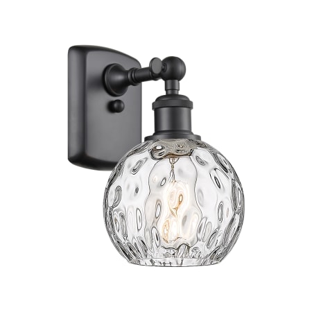 A large image of the Innovations Lighting 516-1W-11-6 Athens Sconce Matte Black / Clear Water Glass