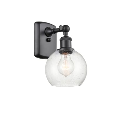 A large image of the Innovations Lighting 516-1W-9-6 Athens Sconce Matte Black / Seedy