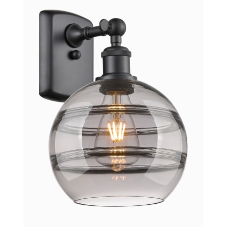 A large image of the Innovations Lighting 516-1W-11-8 Rochester Sconce Matte Black / Light Smoke
