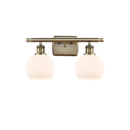 A large image of the Innovations Lighting 516-2W-10-16 Athens Vanity Antique Brass / Matte White