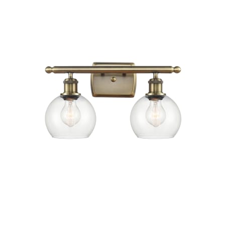 A large image of the Innovations Lighting 516-2W-9-16 Athens Vanity Antique Brass / Clear