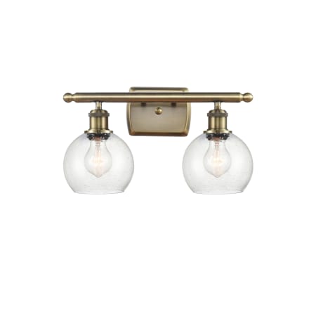 A large image of the Innovations Lighting 516-2W-10-16 Athens Vanity Antique Brass / Seedy