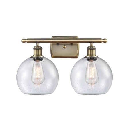 A large image of the Innovations Lighting 516-2W-12-18 Athens Vanity Antique Brass / Seedy