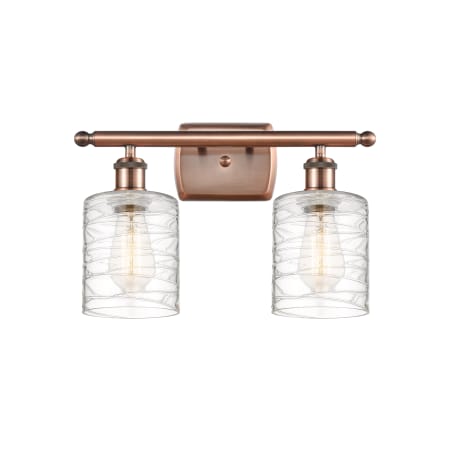 A large image of the Innovations Lighting 516-2W-9-16 Cobbleskill Vanity Antique Copper / Deco Swirl