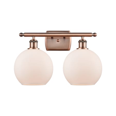 A large image of the Innovations Lighting 516-2W-12-18 Athens Vanity Antique Copper / Matte White