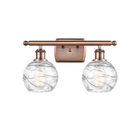 A large image of the Innovations Lighting 516-2W Small Deco Swirl Antique Copper / Clear