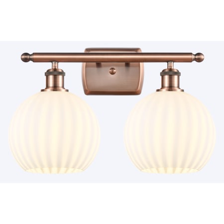 A large image of the Innovations Lighting 516-2W-11-18 White Venetian Vanity Antique Copper / White Venetian