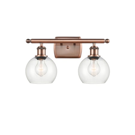 A large image of the Innovations Lighting 516-2W-9-16 Athens Vanity Antique Copper / Clear