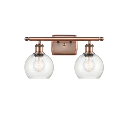 A large image of the Innovations Lighting 516-2W-10-16 Athens Vanity Antique Copper / Seedy