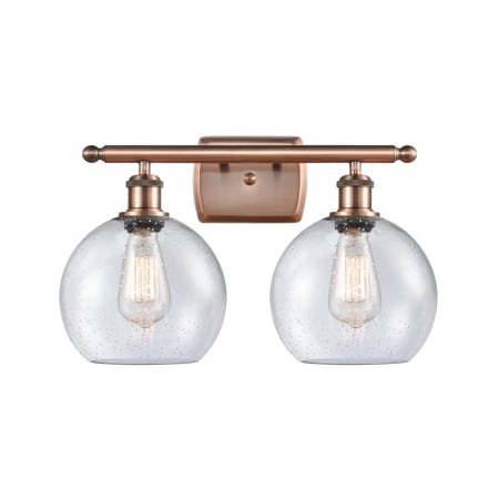 A large image of the Innovations Lighting 516-2W-12-18 Athens Vanity Antique Copper / Seedy