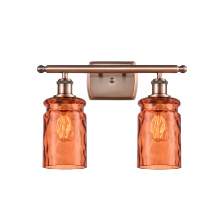 A large image of the Innovations Lighting 516-2W Candor Antique Copper / Turmeric Waterglass