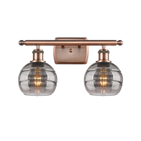 A large image of the Innovations Lighting 516-2W-9-16 Rochester Vanity Antique Copper / Light Smoke