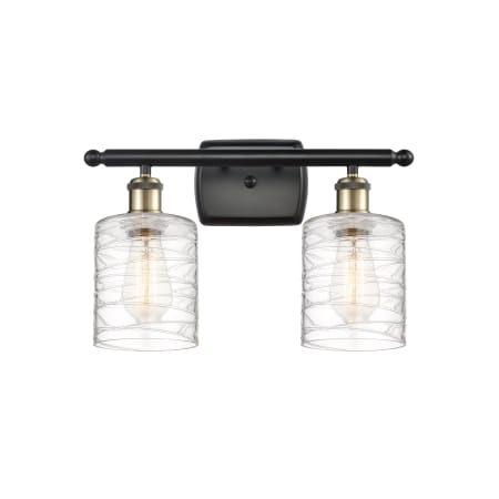 A large image of the Innovations Lighting 516-2W-9-16 Cobbleskill Vanity Black Antique Brass / Deco Swirl