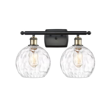 A large image of the Innovations Lighting 516-2W-13-18 Athens Vanity Black Antique Brass / Clear Water Glass