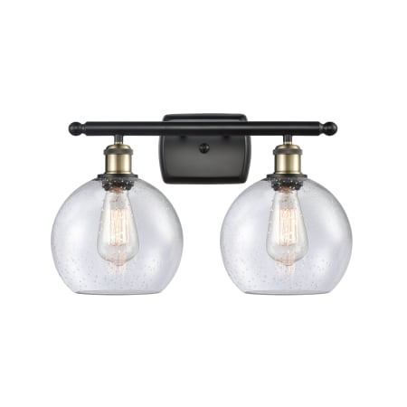 A large image of the Innovations Lighting 516-2W-12-18 Athens Vanity Black Antique Brass / Seedy