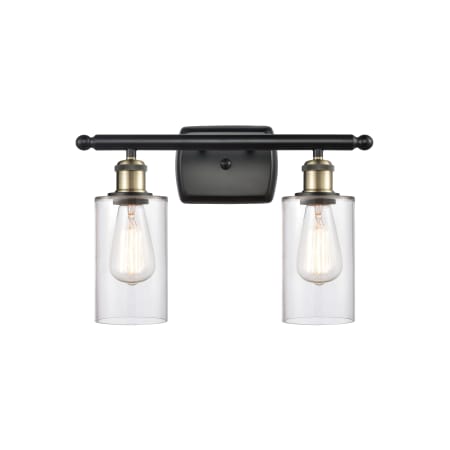 A large image of the Innovations Lighting 516-2W-12-16 Clymer Vanity Clear / Black Antique Brass