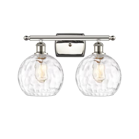 A large image of the Innovations Lighting 516-2W-13-18 Athens Vanity Polished Nickel / Clear Water Glass