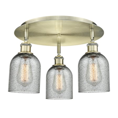 A large image of the Innovations Lighting 516-3C-10-17 Caledonia Flush Antique Brass / Charcoal