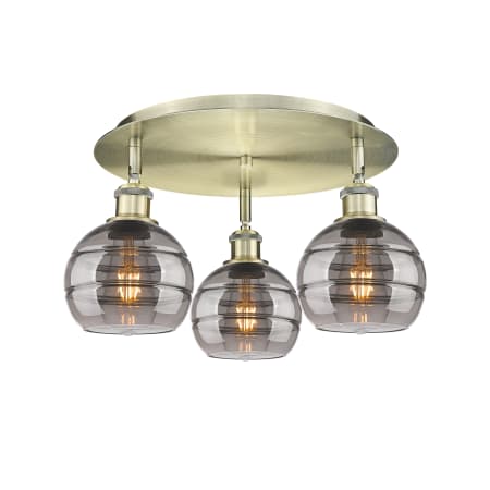 A large image of the Innovations Lighting 516-3C-9-18 Rochester Flush Antique Brass / Light Smoke