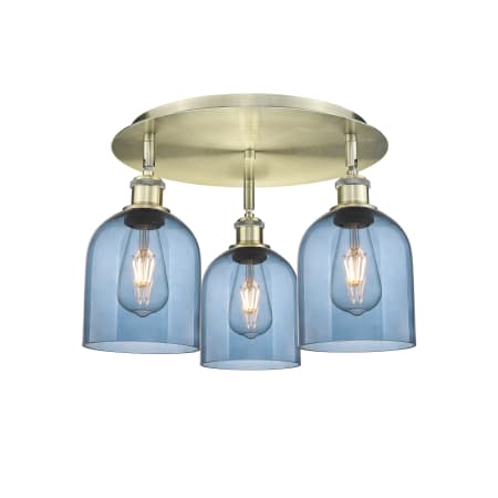 A large image of the Innovations Lighting 516-3C-11-18 Bella Flush Antique Brass / Princess Blue