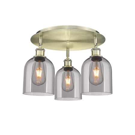 A large image of the Innovations Lighting 516-3C-11-18 Bella Flush Antique Brass / Light Smoke