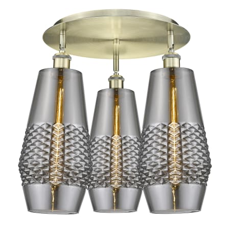 A large image of the Innovations Lighting 516-3C-17-19 Windham Flush Antique Brass / Smoked