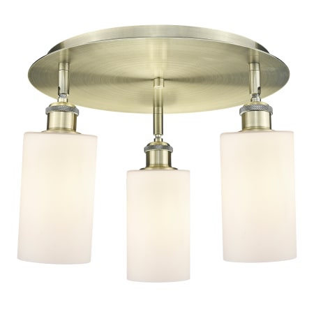 A large image of the Innovations Lighting 516-3C-10-16 Clymer Flush Antique Brass / Matte White