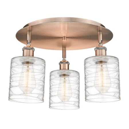 A large image of the Innovations Lighting 516-3C-10-18 Cobbleskill Flush Antique Copper / Deco Swirl