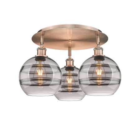 A large image of the Innovations Lighting 516-3C-11-20 Rochester Flush Antique Copper / Light Smoke