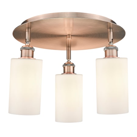 A large image of the Innovations Lighting 516-3C-10-16 Clymer Flush Antique Copper / Matte White