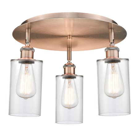 A large image of the Innovations Lighting 516-3C-10-16 Clymer Flush Antique Copper / Clear