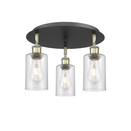 A large image of the Innovations Lighting 516-3C-10-16 Clymer Flush Black Antique Brass / Seedy