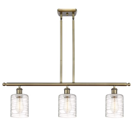 A large image of the Innovations Lighting 516-3I-10-36 Cobbleskill Linear Antique Brass / Deco Swirl