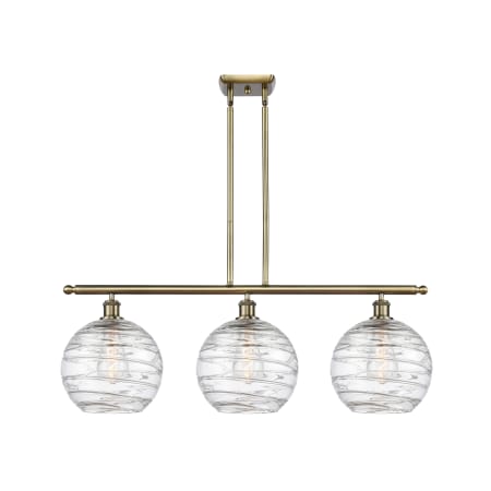 A large image of the Innovations Lighting 516-3I-13-37 Athens Linear Antique Brass / Clear Deco Swirl