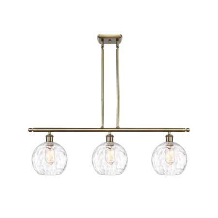 A large image of the Innovations Lighting 516-3I-11-36 Athens Linear Antique Brass / Clear Water Glass