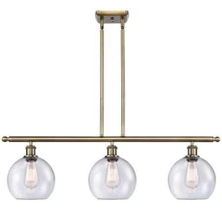 A large image of the Innovations Lighting 516-3I-11-36 Athens Linear Antique Brass / Seedy