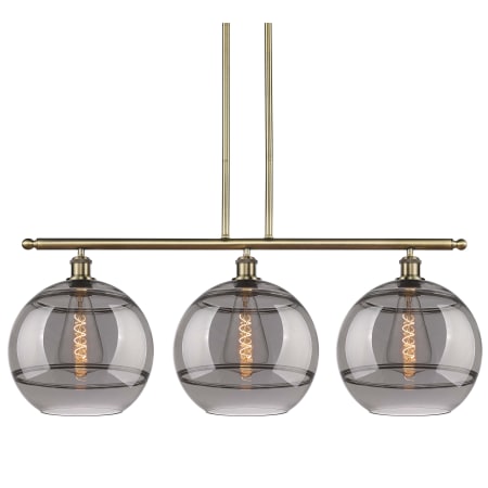 A large image of the Innovations Lighting 516-3I-14-39 Rochester Pendant Antique Brass / Light Smoke