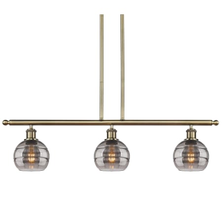 A large image of the Innovations Lighting 516-3I-9-36 Rochester Pendant Antique Brass / Light Smoke