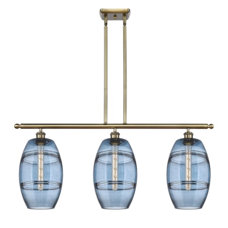 A large image of the Innovations Lighting 516-3I-10-36 Vaz Linear Antique Brass / Blue