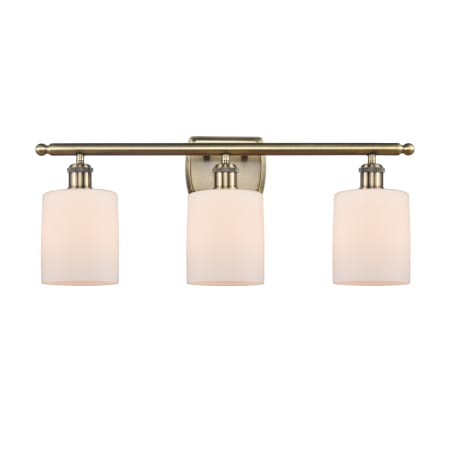 A large image of the Innovations Lighting 516-3W-10-26 Cobbleskill Vanity Matte White / Antique Brass